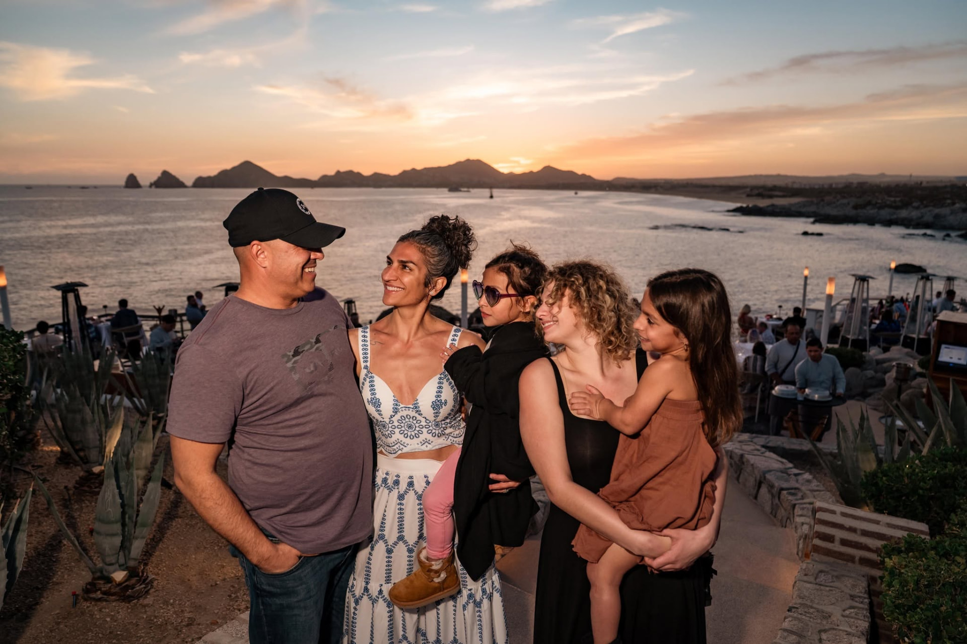 Johnny and Nikole Bigley with their daughters at sunset